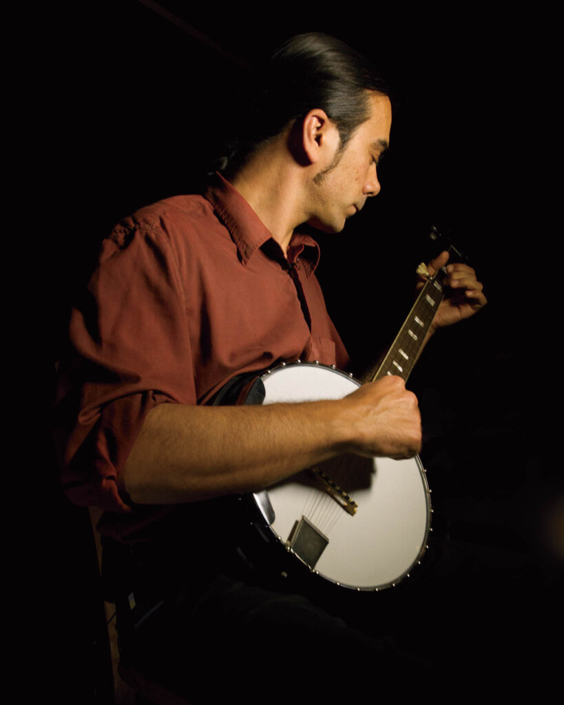 Hunter Robertson playing a Harmony banjo.